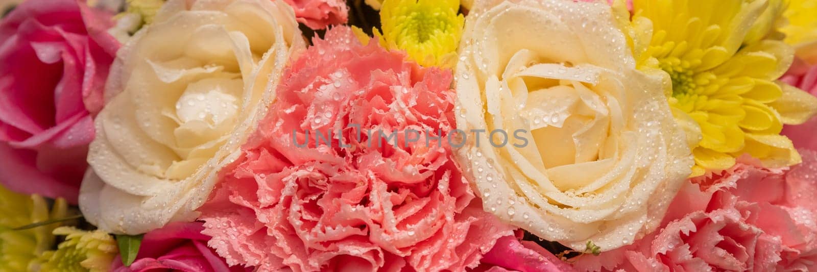 Beautiful summer banner for a website with a bouquet of bright flowers . Bouquet of pink roses, chrysanthemums and carnations.natural background for the designer.Congratulation or present concept by YuliaYaspe1979