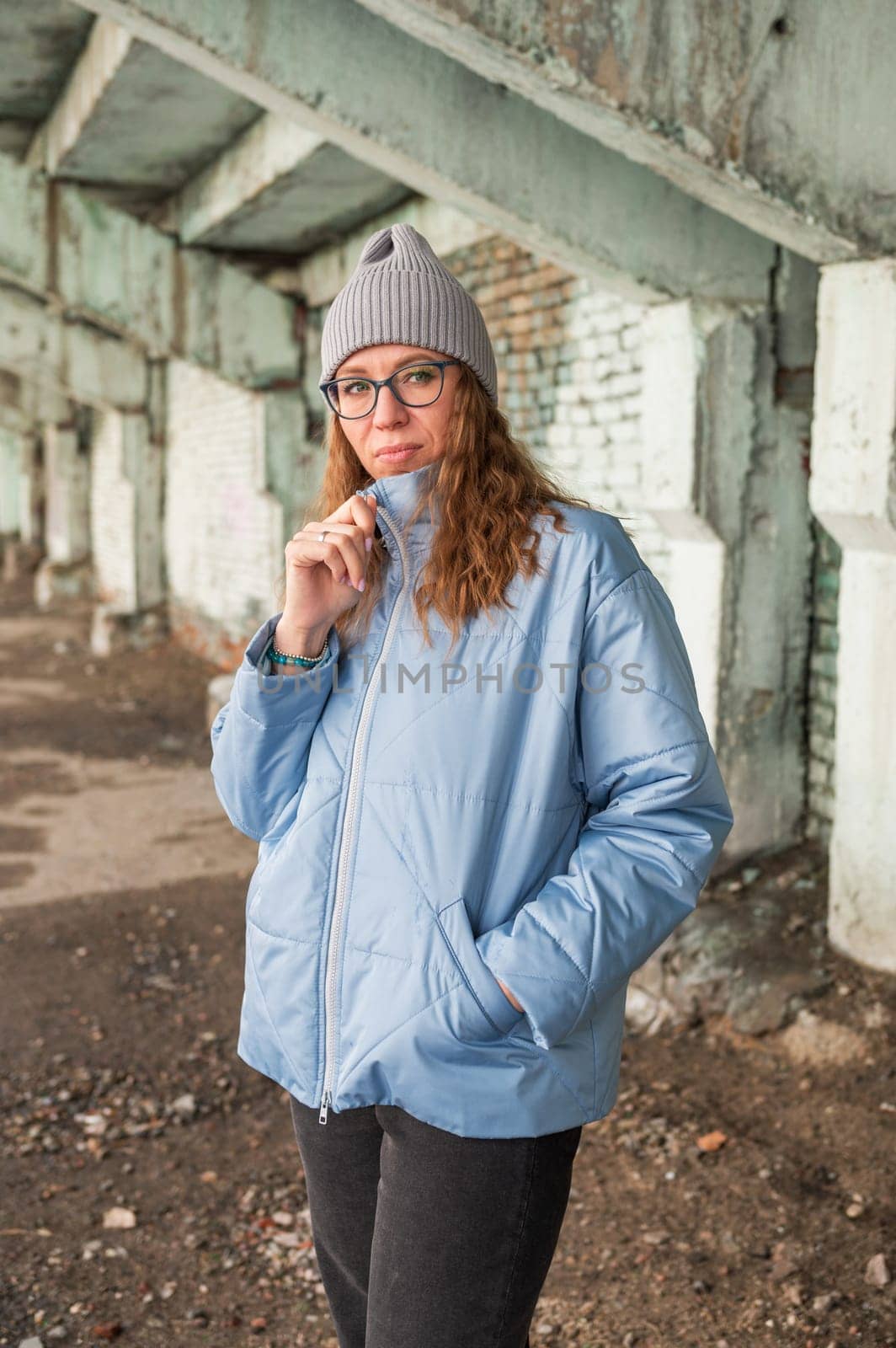 Portrait of a stylish woman in blue jacket. Spring outdoor portrait.