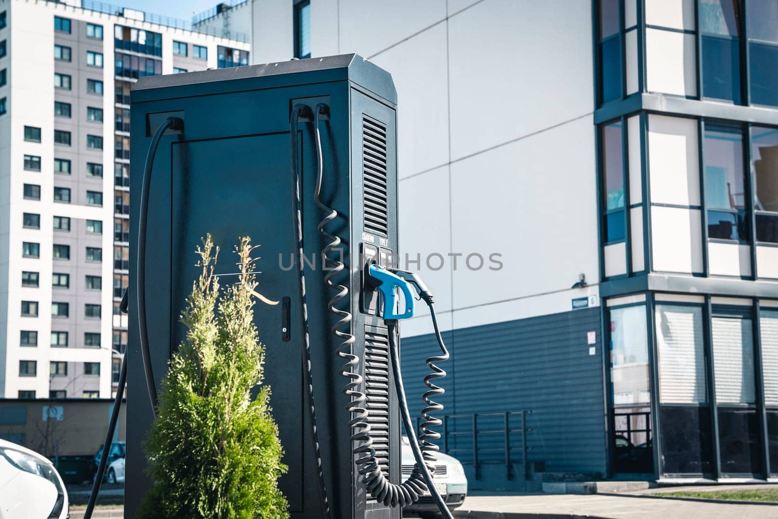 Electric vehicle Charging station. plug-in power cable. A power supply for charging an electric vehicle. Eco electric concept. Car charger. Alternative fuel. green energy technology