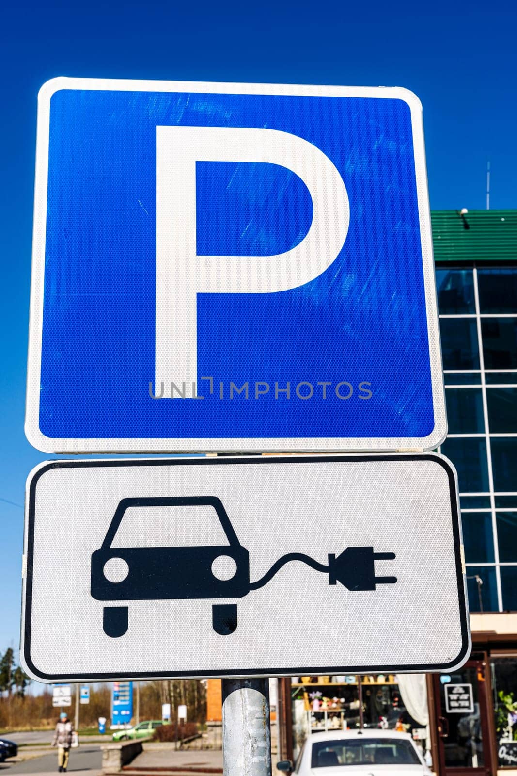 Road sign Charging station for electric vehicles . plug-in power cable. A power source for charging an electric vehicle. The concept of eco-electricity. Car charger. Alternative fuel. green energy technology