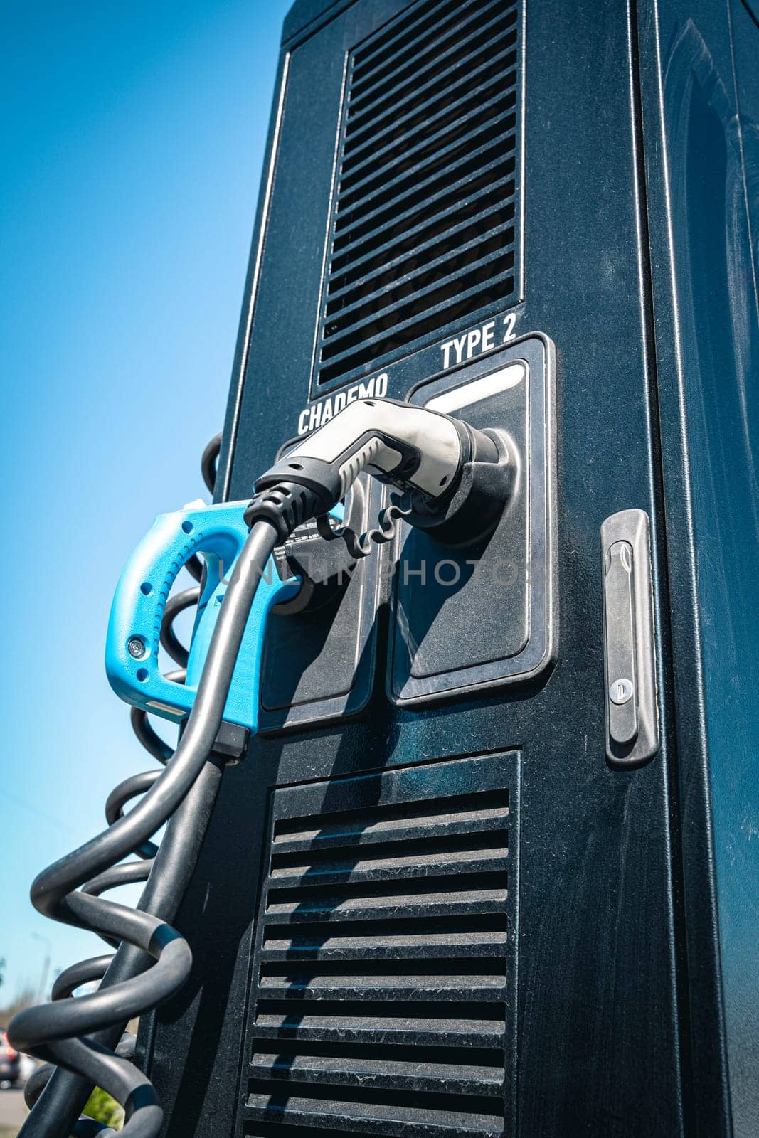 Electric vehicle Charging station. plug-in power cable. A power supply for charging an electric vehicle. Eco electric concept. Car charger. Alternative fuel. green energy technology