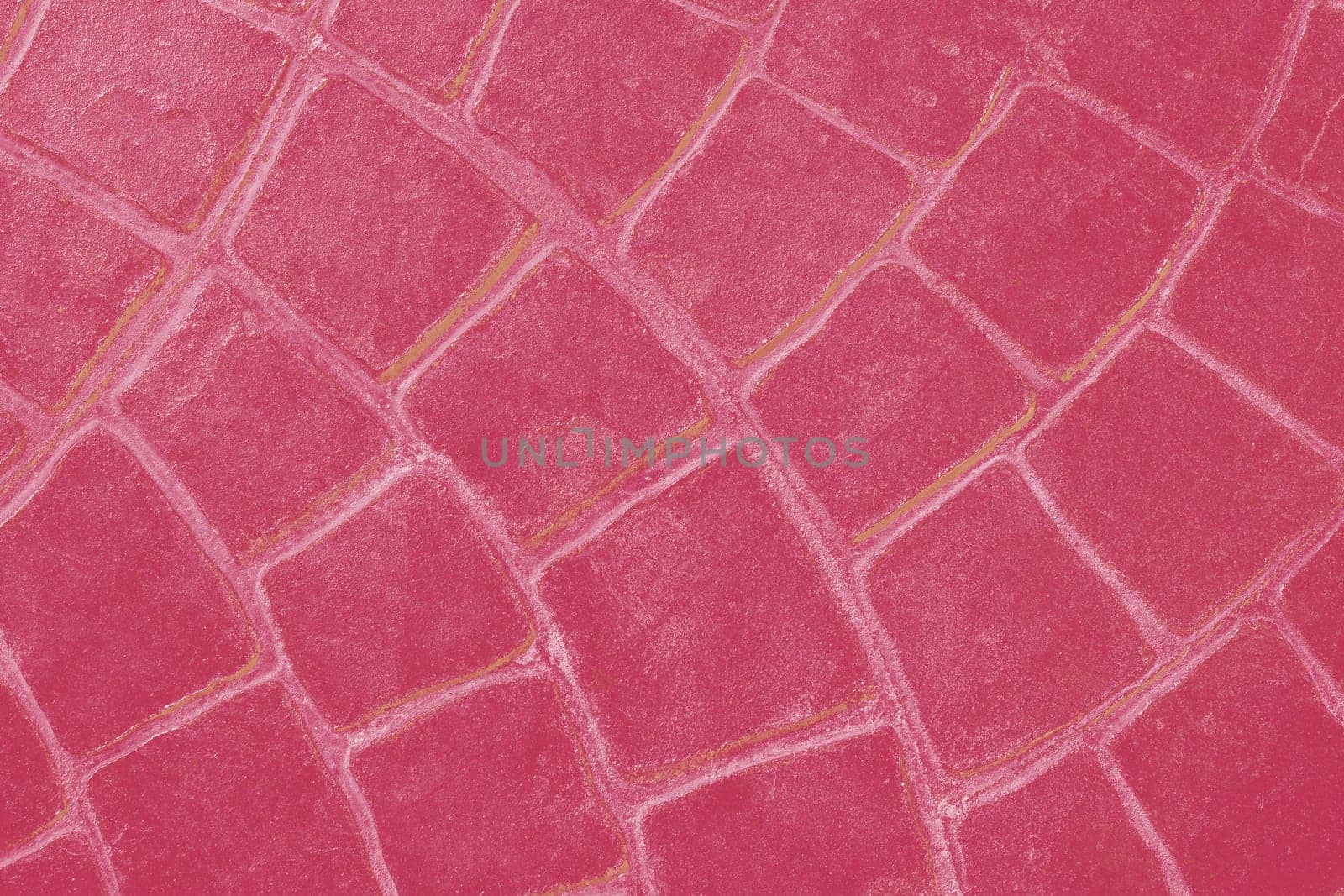 Background of ceramic tiles in new trendy color of 2023 Viva Magenta. Monochrome. Abstract.