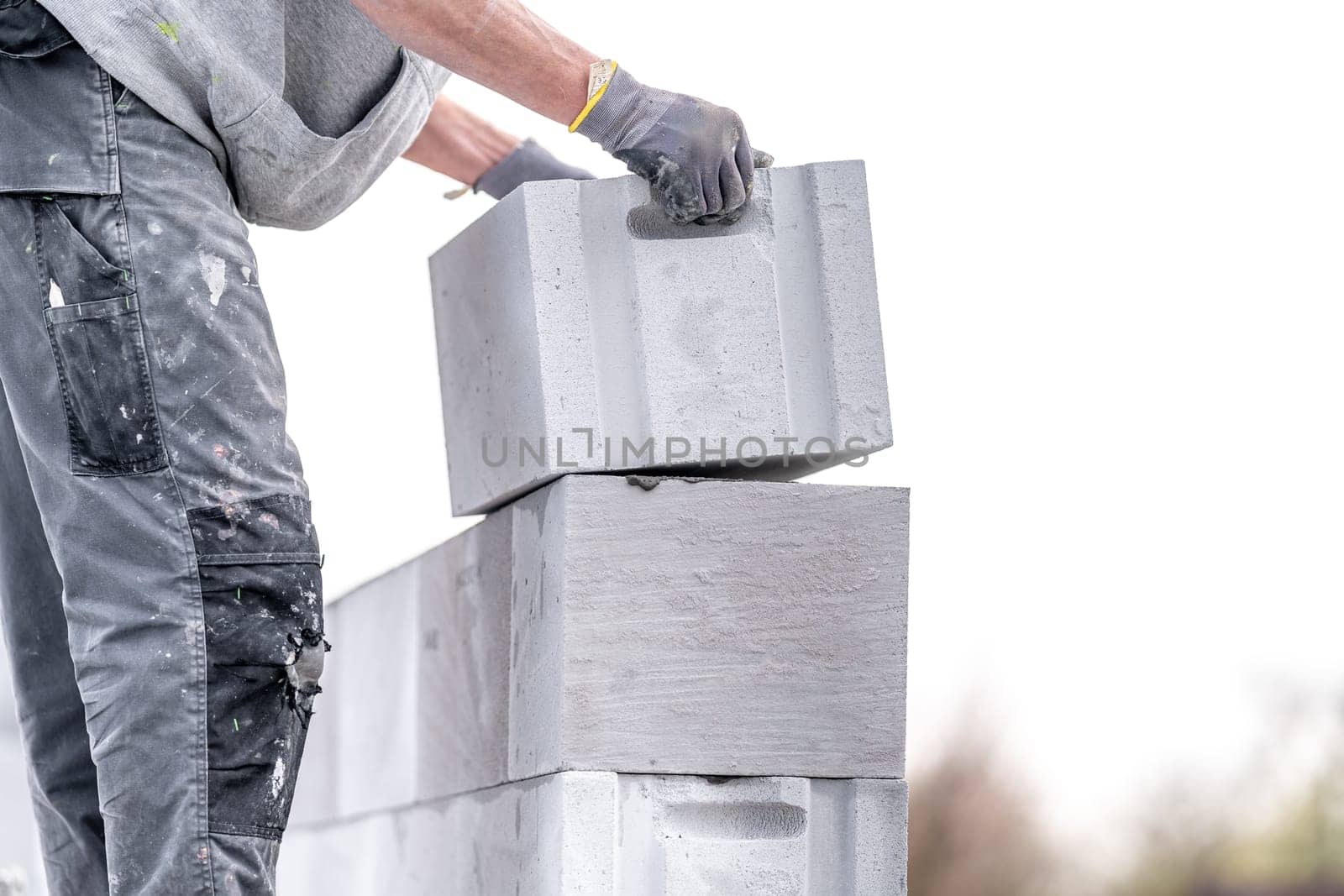 construction of a wall of a house made of concrete bricks. High quality photo