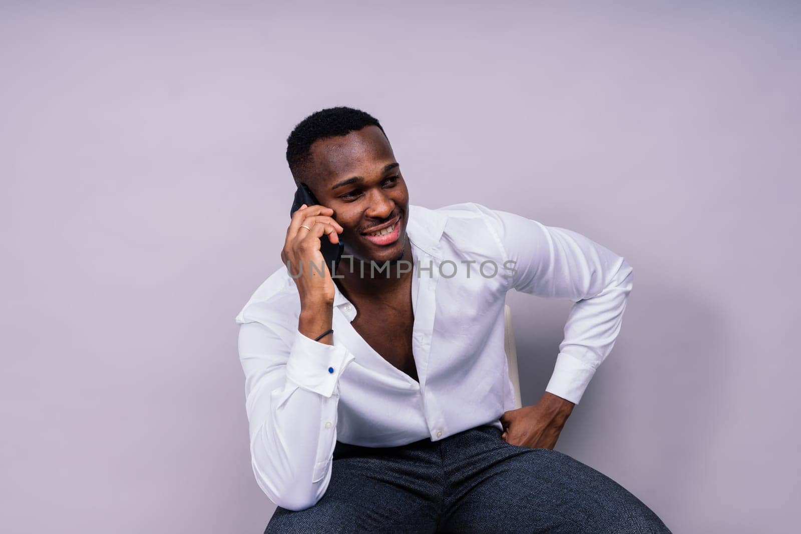 African American millennial businessman isolated on a studio background, successful male formal suit