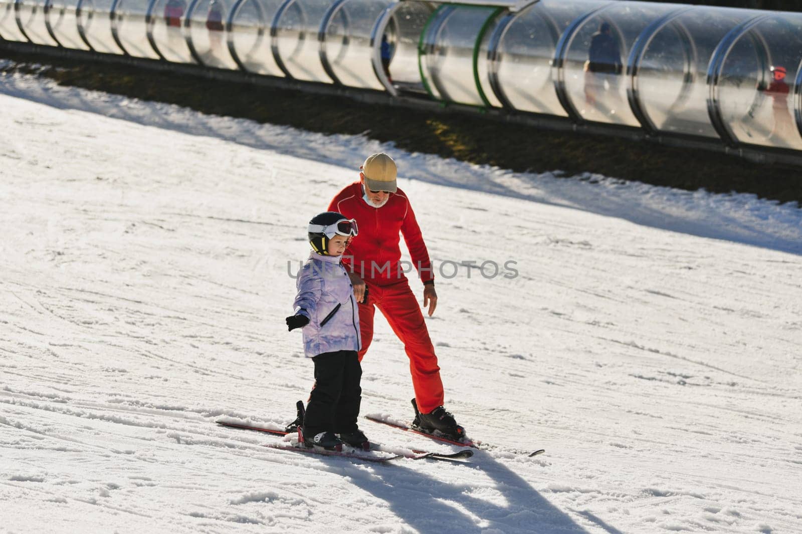 Ski coach giving a lesson on how to ski