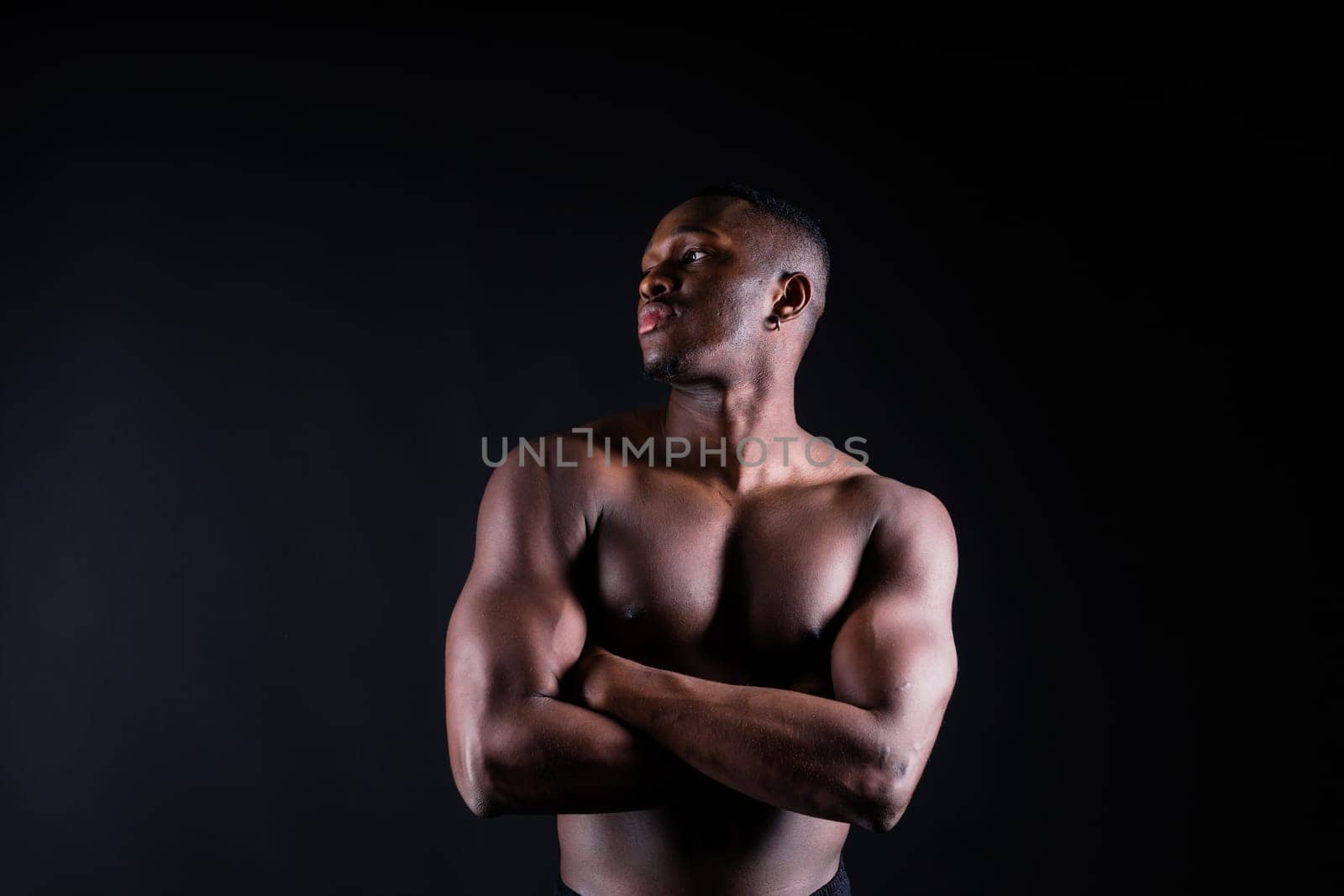 Muscular black african man with muscles abs abdominal, exercise determination and success