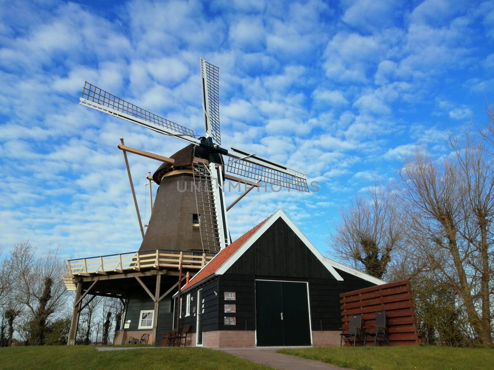 Dutch windmill with nice clouds in the background. In the Netherlands, Holland.