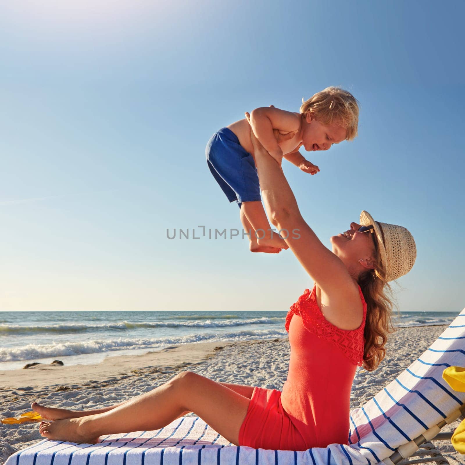 Living it up at the beach. a single mother spending the day at the beach with her little boy