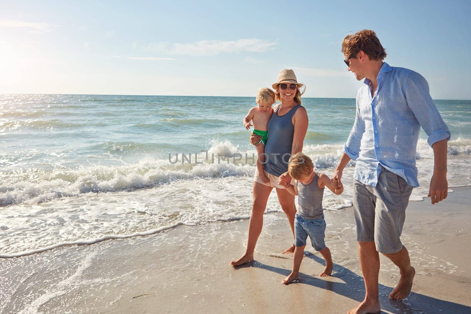 Its beach season. a young family enjoying a summer day out at the beach