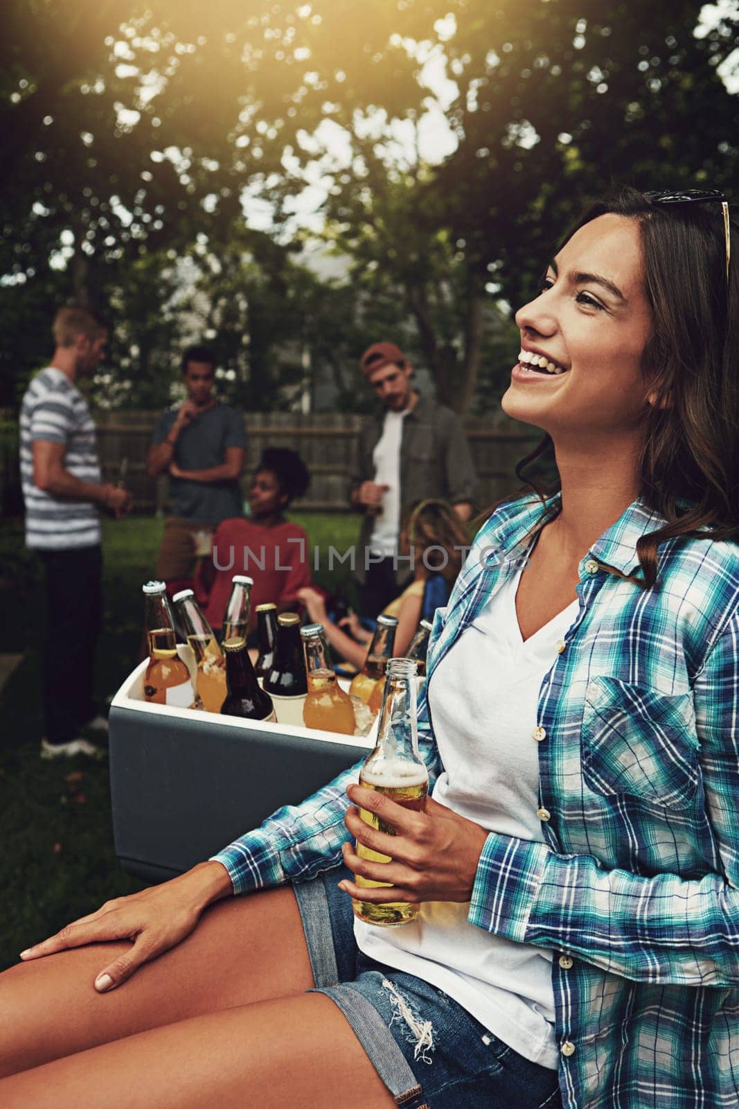 The best way to cool off this summer. a young woman enjoying a party with friends outdoors