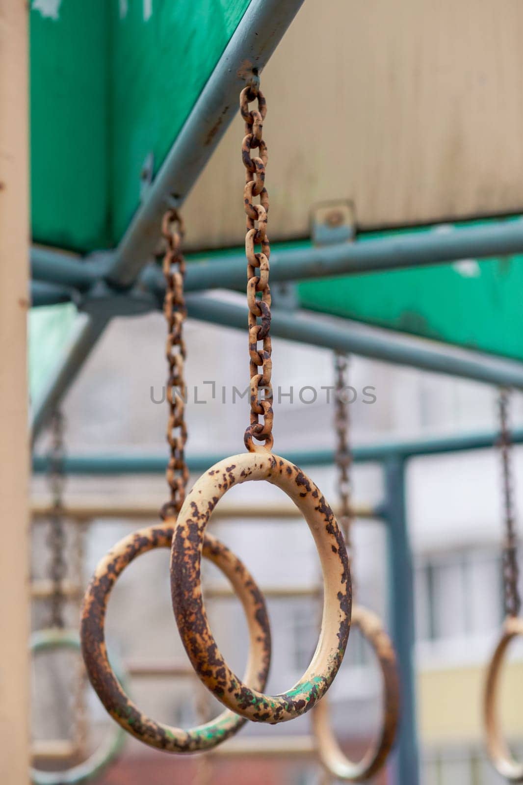 An iron chain with grey and semi-trusted oval rings and a background by AnatoliiFoto