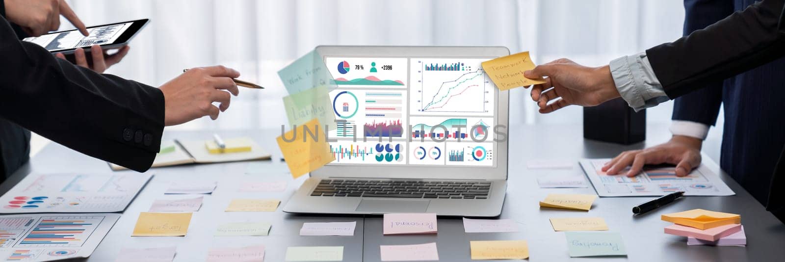 Analyst team use sticky note for creative and analytic brainstorm for business idea with BI data dashboard on laptop screen. Analysis financial data visualization tech for marketing strategy. Prodigy