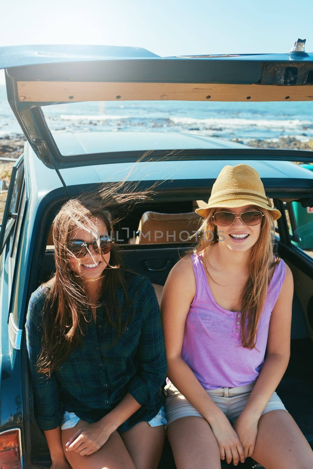 The best place to be in the summer. two friends on a road trip near the ocean