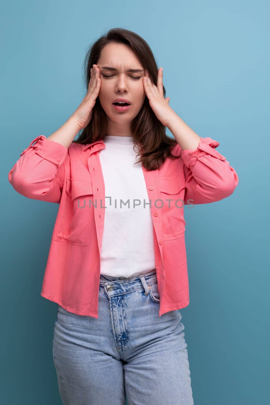 upset brunette woman with dark hair below her shoulders feels bad.