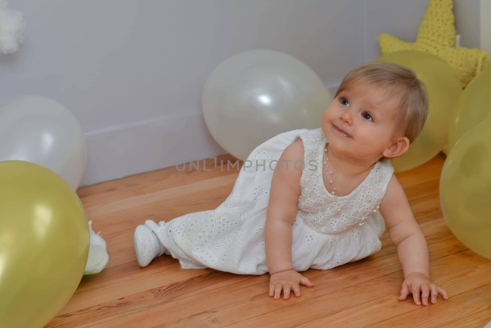 Birthday toddler girl with balloons