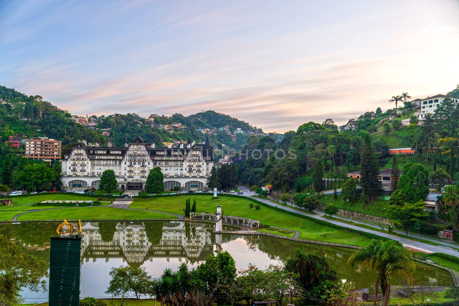 Beautiful long exposure shot of Quitandinha Palace and its lake, shaped like Brazil, at sunrise in Petropolis.