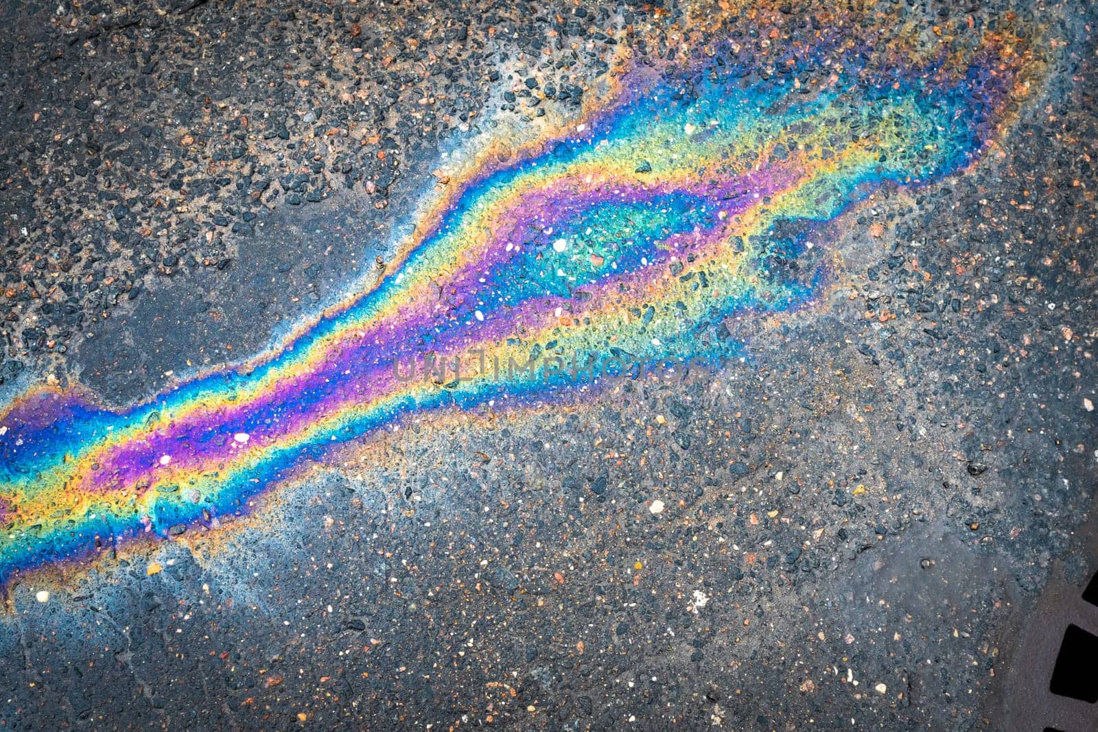 Waste from the oil industry flows down the storm drain with rainwater.