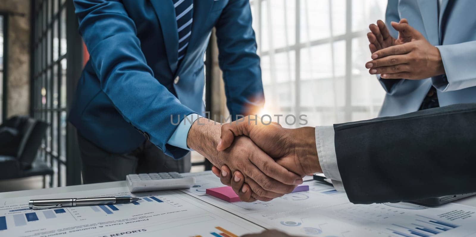 Business handshake for teamwork of business merger and acquisition,successful negotiate,hand shake,two businessman shake hand with partner to celebration partnership and business deal concept