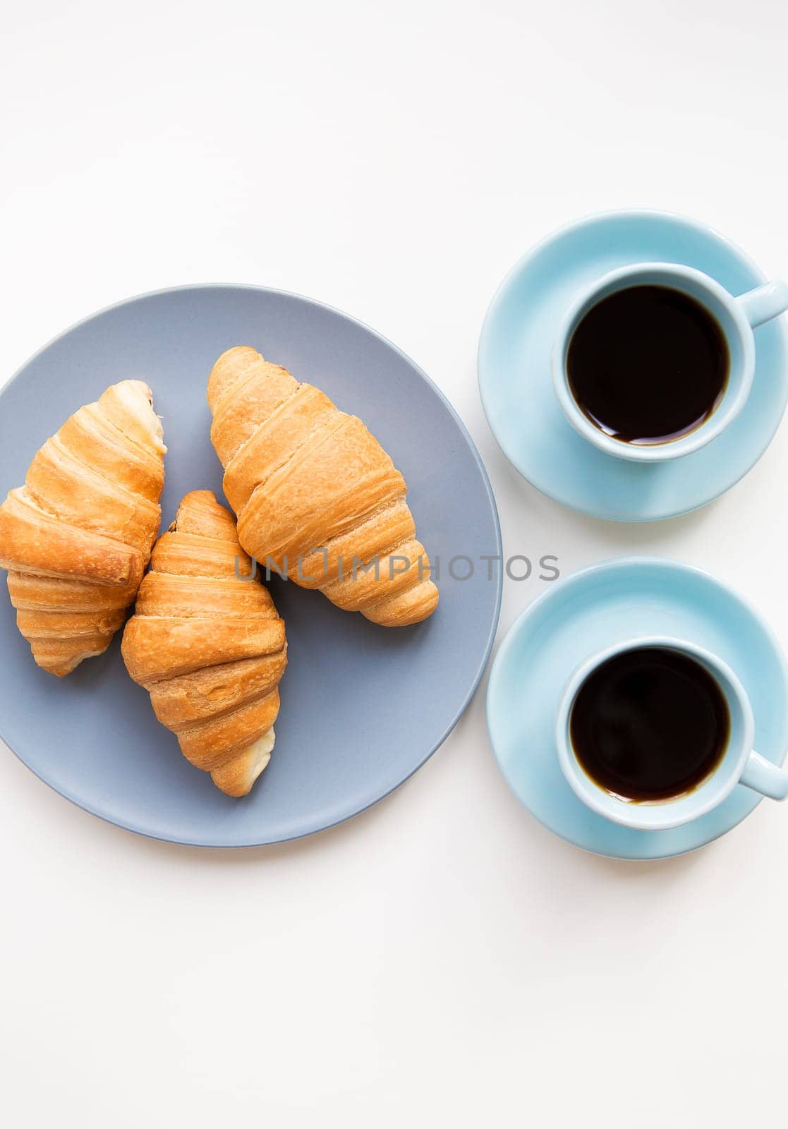 cup of coffee with croissant on white background by sfinks