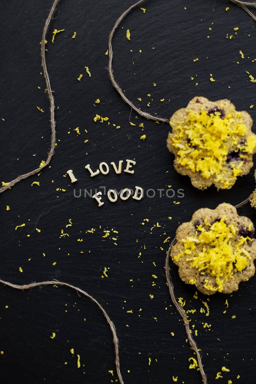 lemon cupcakes on a black background by sfinks