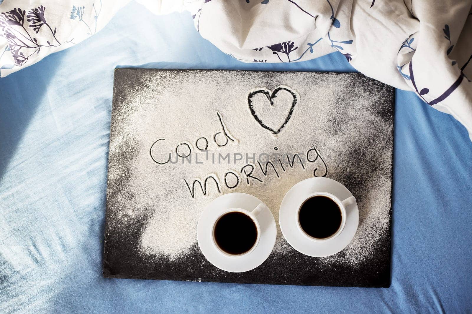 good morning inscription flour on a board with cups of coffee, heart Valentine's day by sfinks