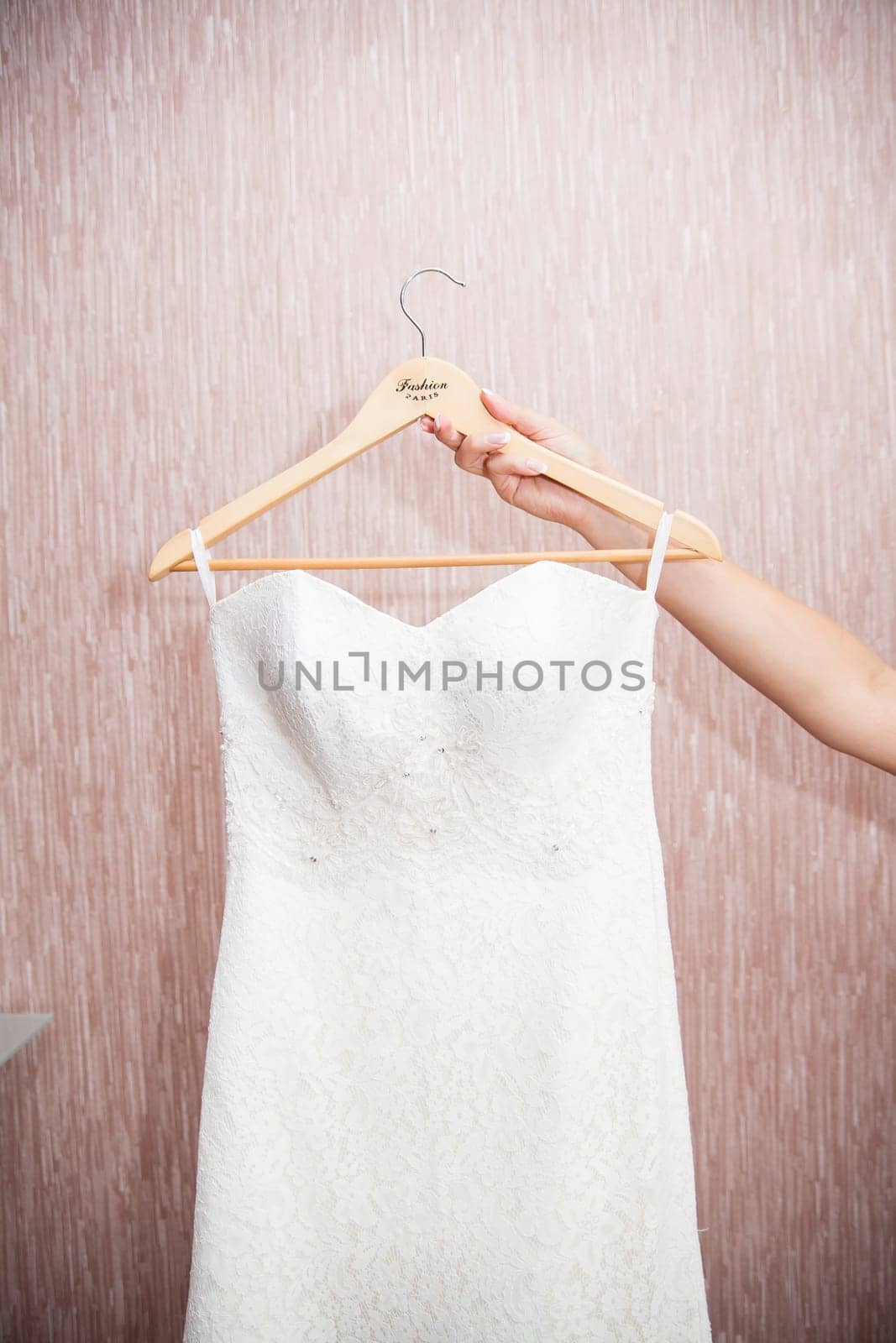 Modern white wedding dress hanging on the hanger