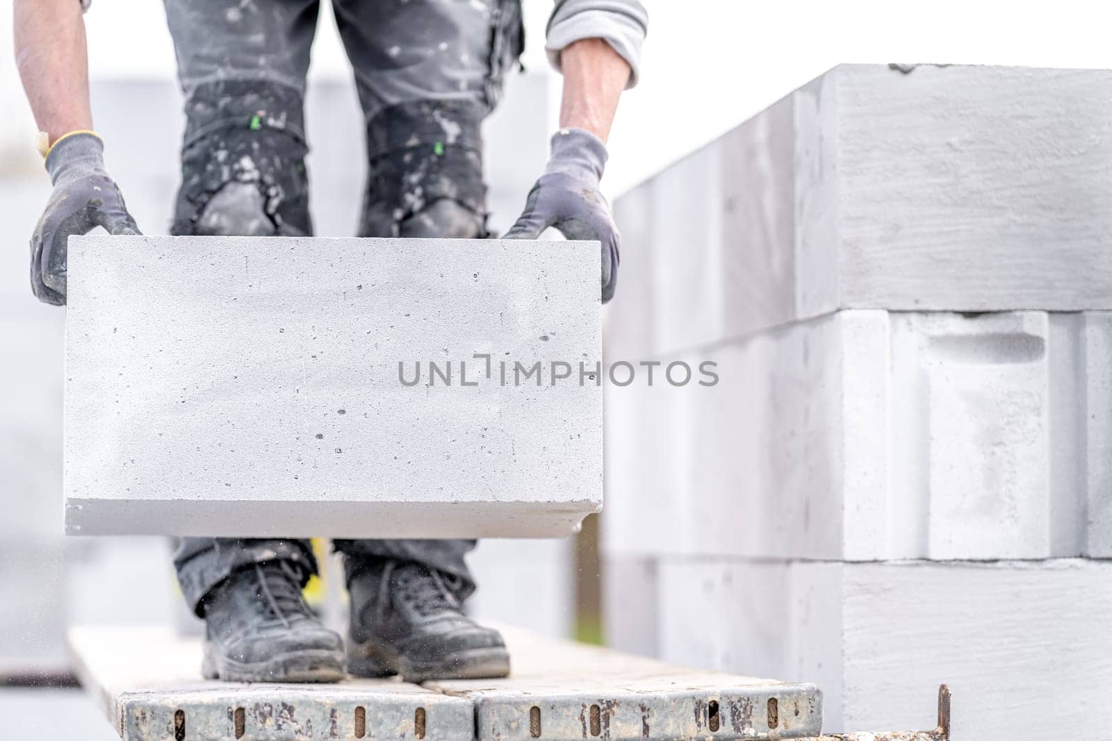 construction of a wall of a house made of concrete bricks. High quality photo