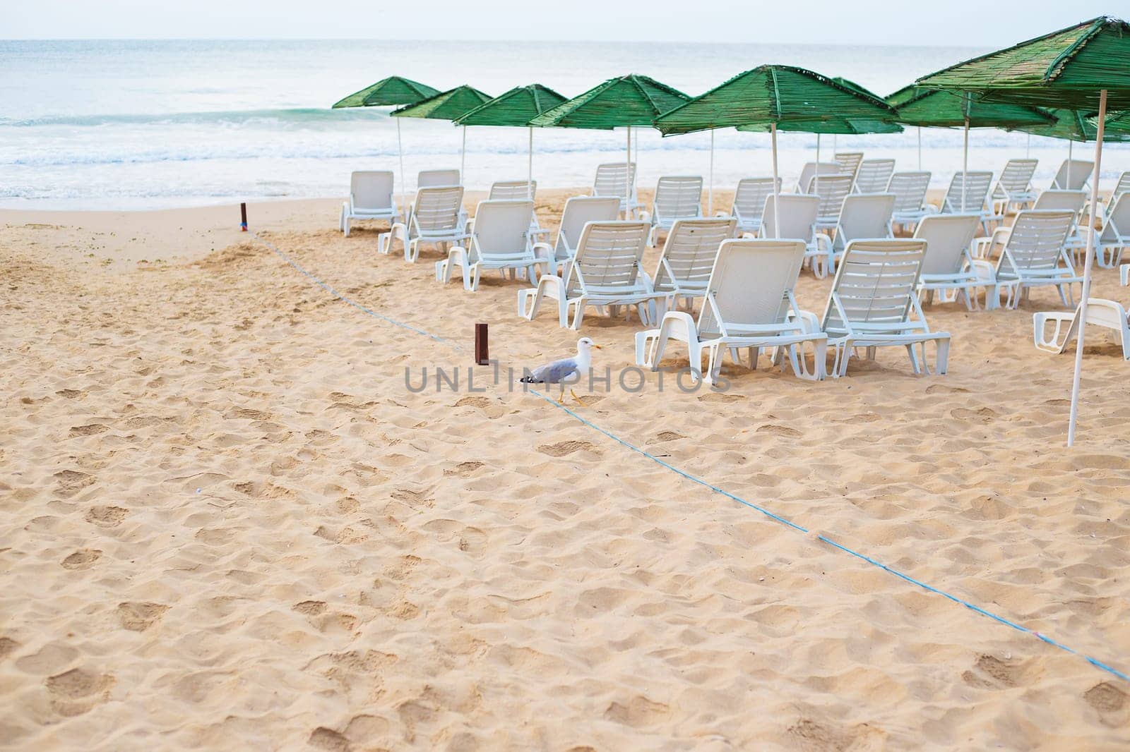 Beautiful chic sea - beach, umbrellas, summer. Nessebar, Bulgaria. by sfinks