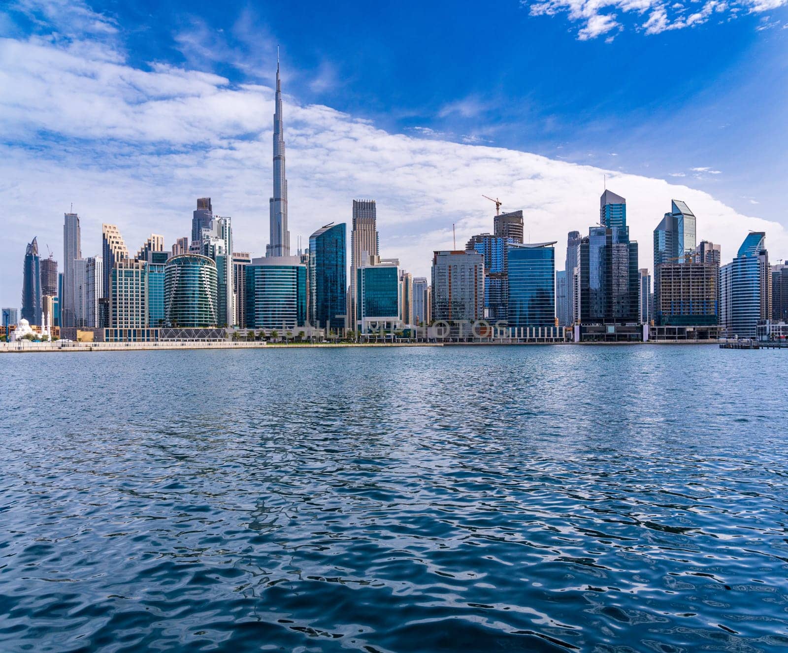 Skyline of the downtown district of Dubai seen from the Canal water level in Business Bay