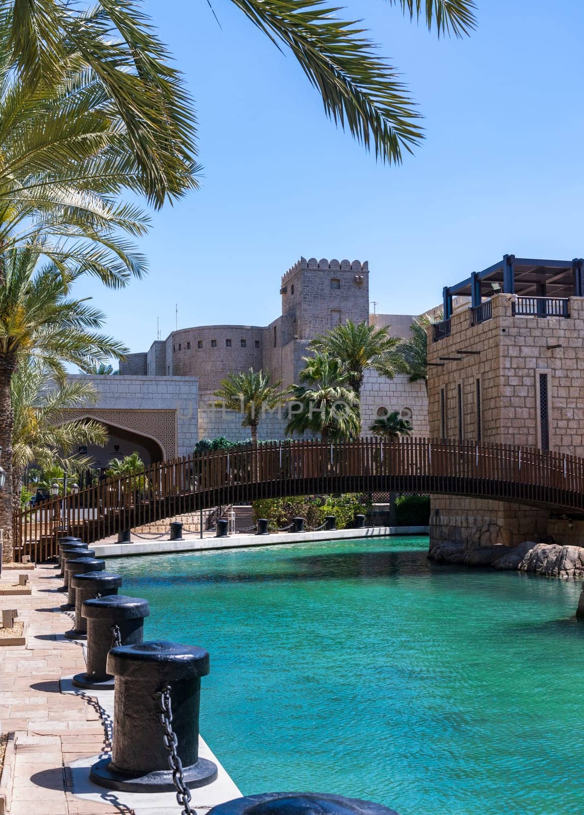 Waterway with old wooden bridge in the Souk Madinat Junction mall