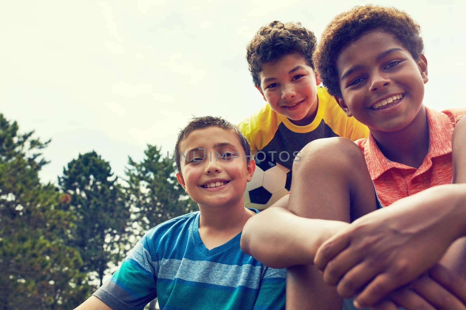 These are my buddies. Portrait of adorable young boys outdoors. by YuriArcurs