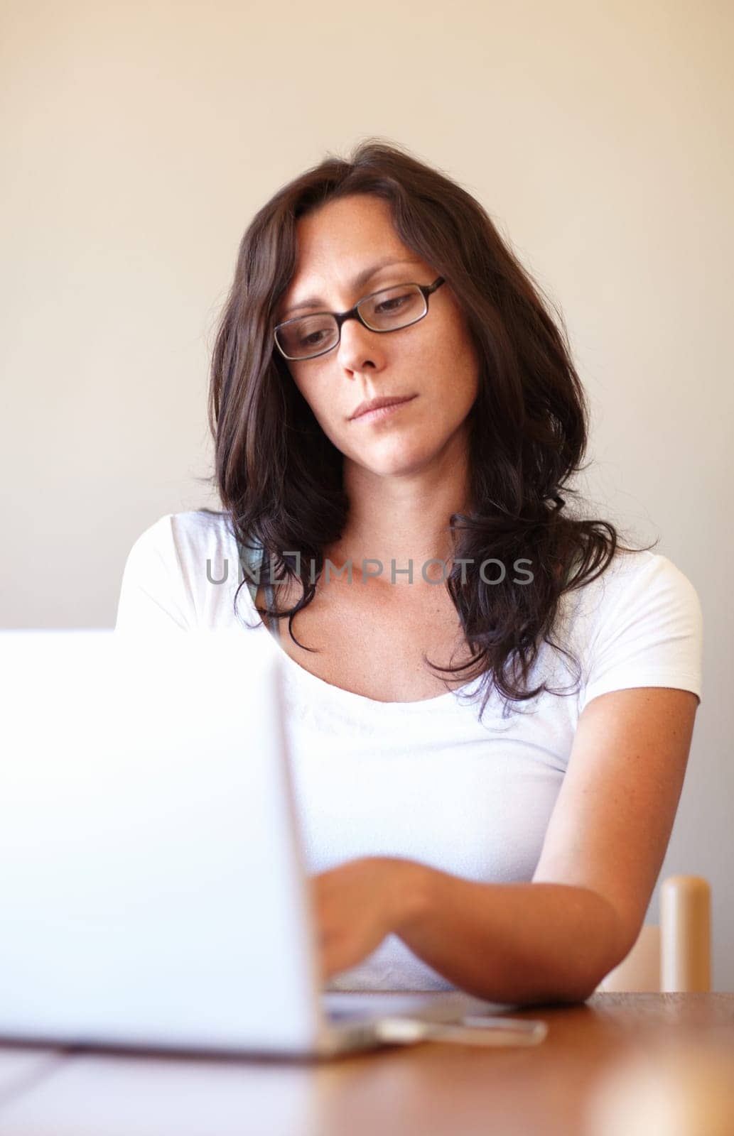 Woman, reading and typing on laptop in home office for remote work, entrepreneurship or online business. Businesswoman, entrepreneur and computer for research, email communication or social network by YuriArcurs