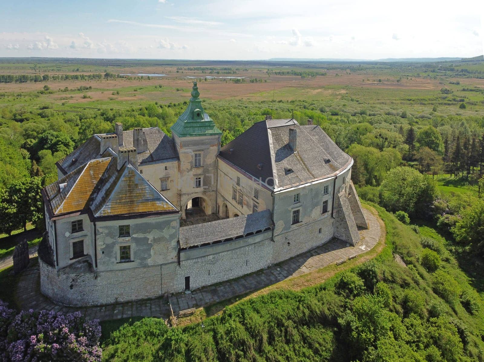 Tourism. Journey through Western Ukraine. Aerial view of the Olesky Castle. Very beautiful castle near Lviv. by aprilphoto