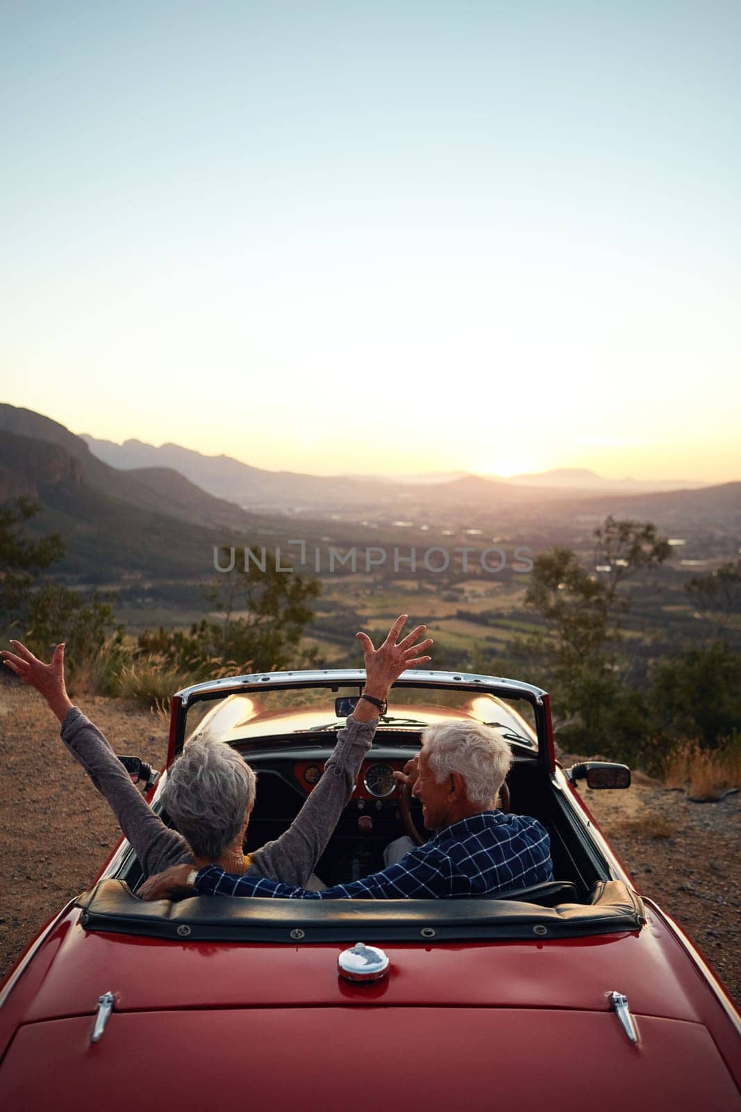 We achieved our retirement goals. a joyful senior couple enjoying a road trip. by YuriArcurs