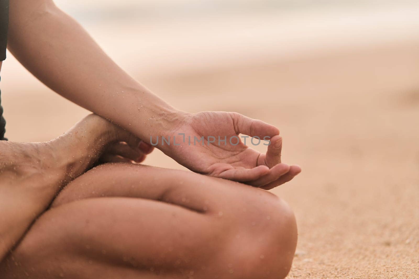 Beautiful girl doing yoga at the beach. High quality photo