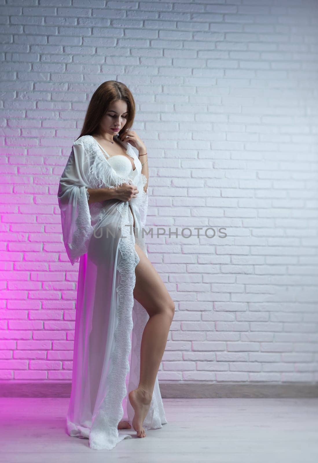 sexy woman in a delicate white nightgown and underwear in a room against the background of a wall of a copy paste by Rotozey