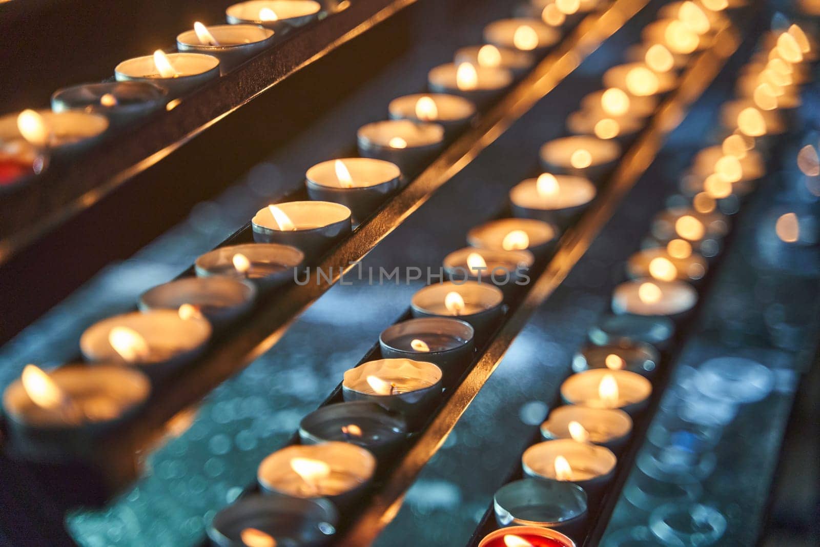 Many candles burn in a temple in Vienna. High quality 4k footage.