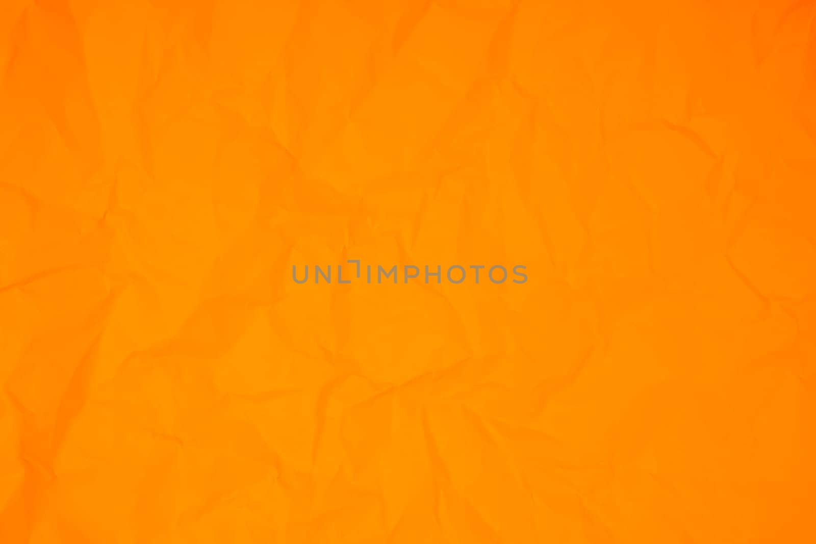 Orange color crumpled paper texture background