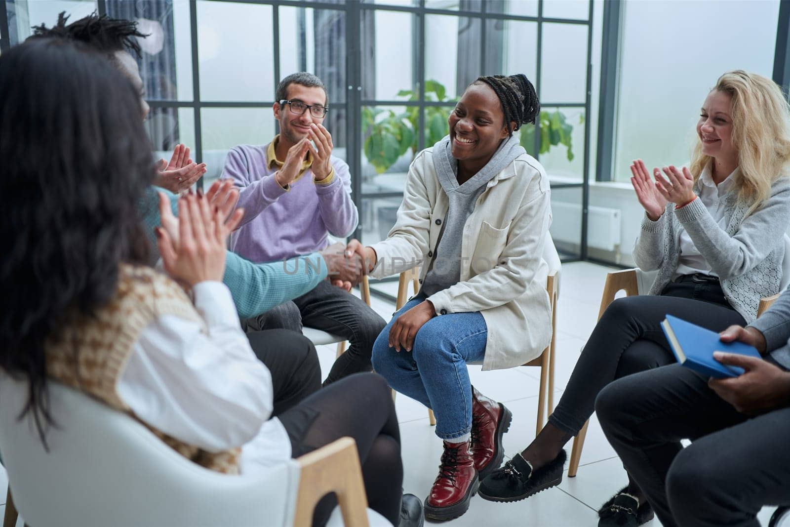 Different groups of people communicate with each other during business seminar or training.