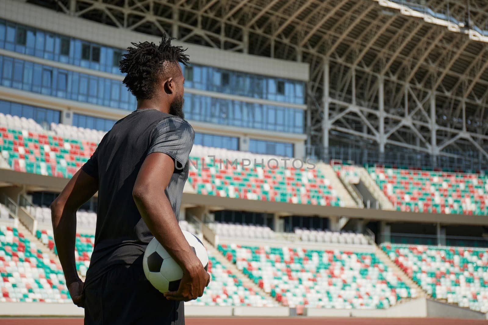 African American football player in training. profile of a black football player in training
