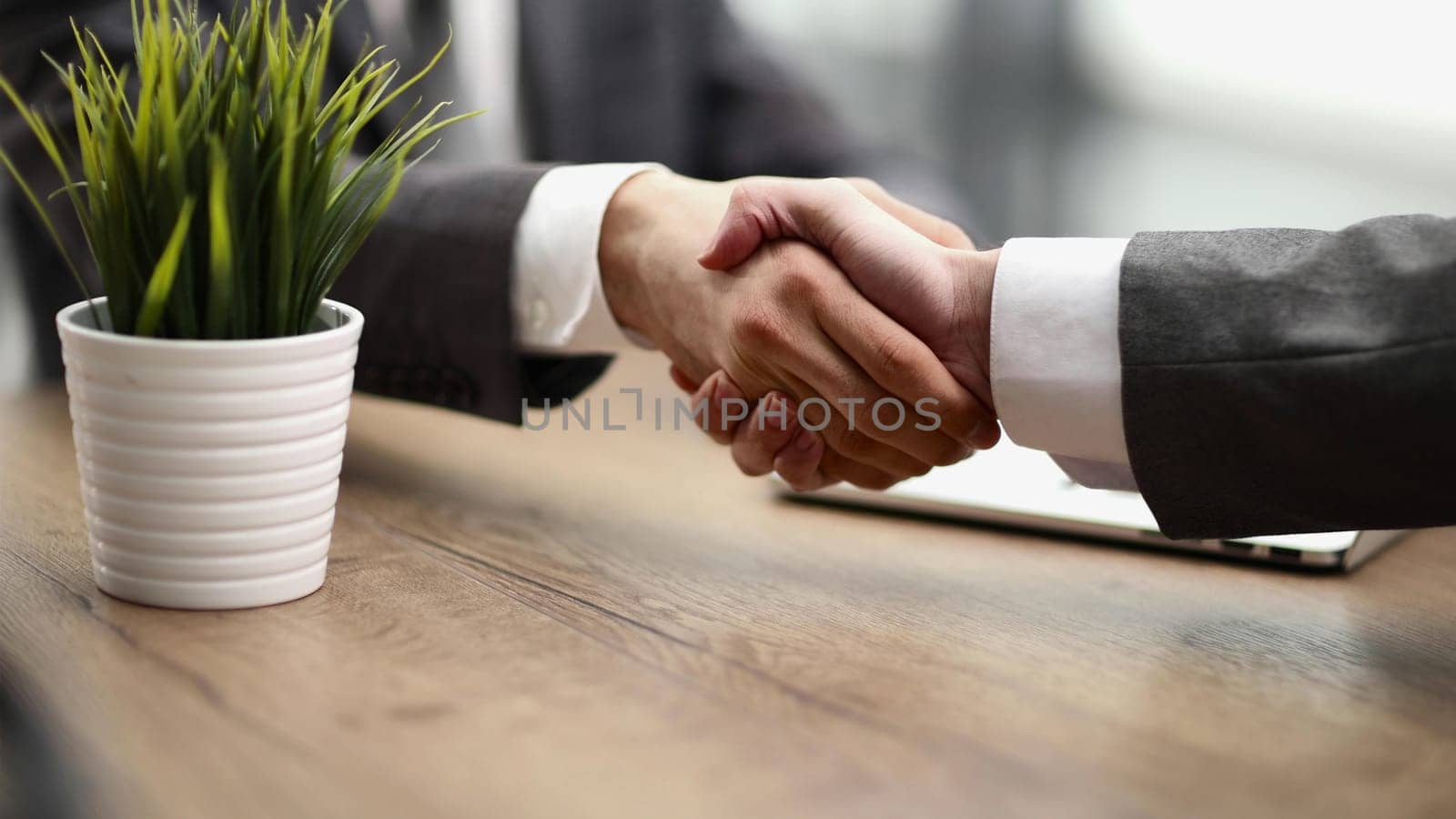 Handshake of two businessmen who enters into the contract