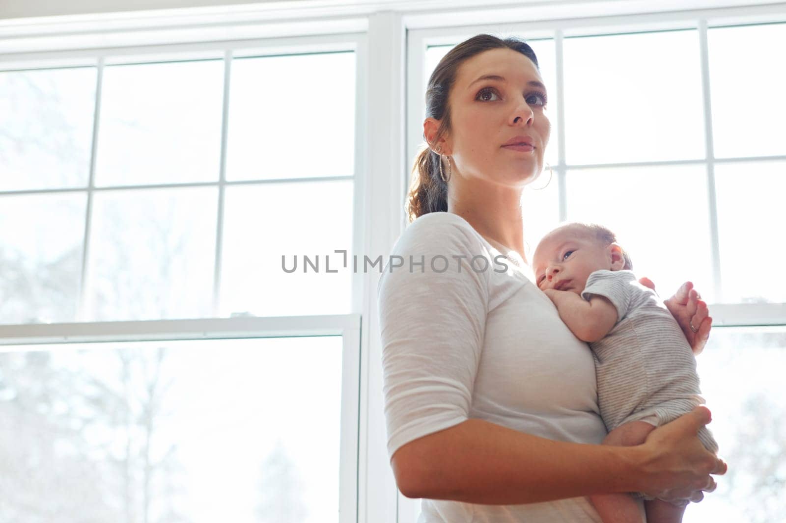 Shes holding her biggest blessing. a mother holding her newborn baby