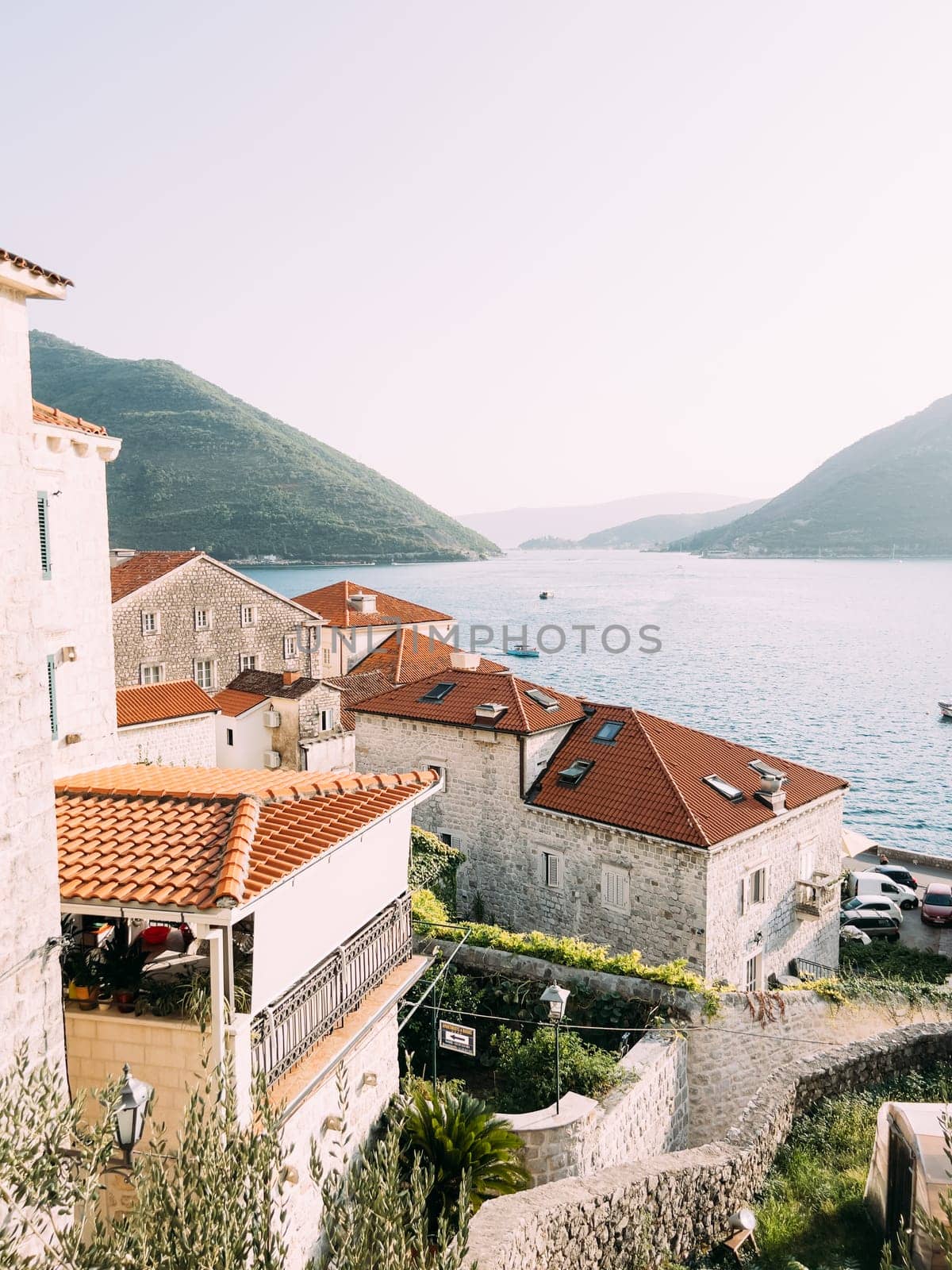 View over the roofs of old houses on the Bay of Kotor. Perast, Montenegro. High quality photo