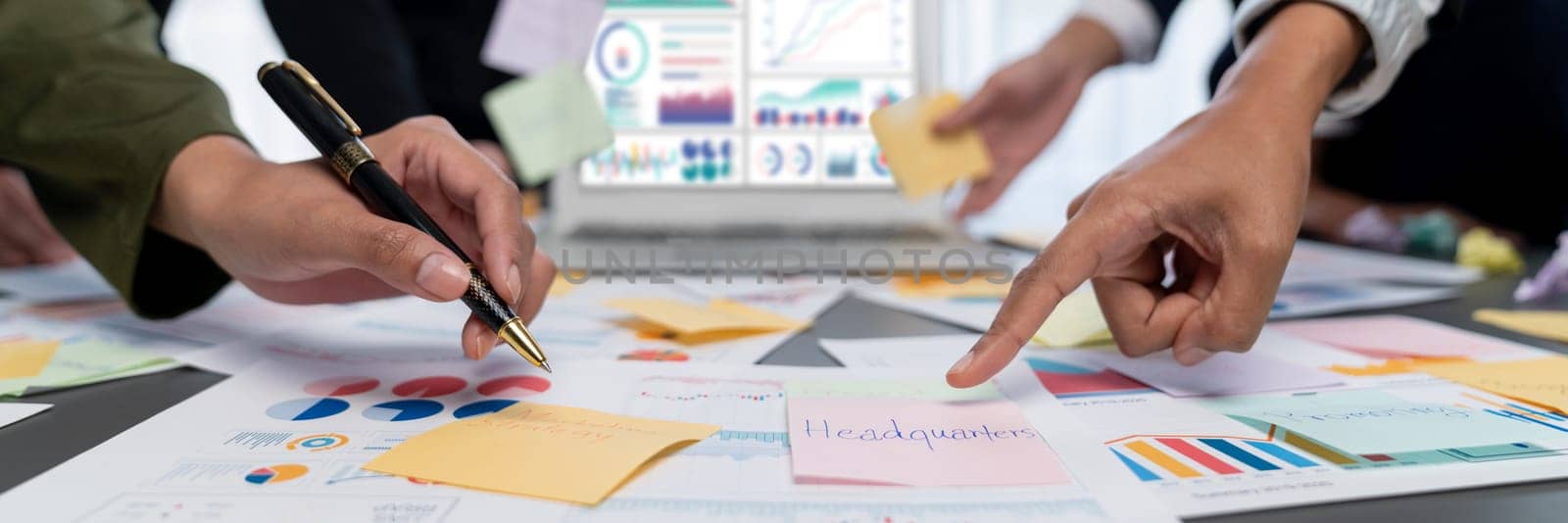 Analyst team use sticky note for financial insight with business Fintech papers for data analysis dashboard. Creative and analytic teamwork idea brainstorming for strategic business marketing. Prodigy