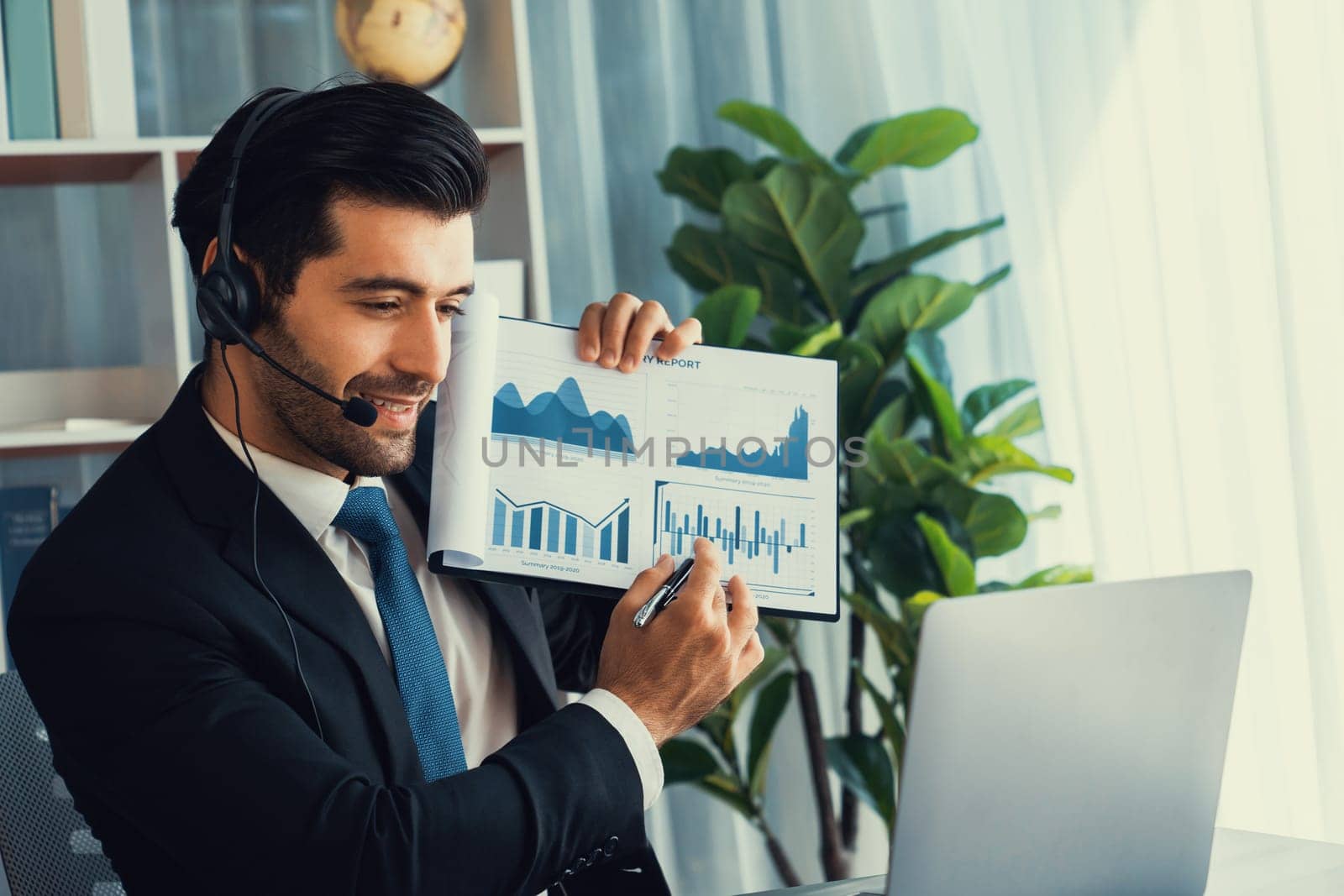 Businessman with headphone present BI paper during online meeting. Fervent by biancoblue