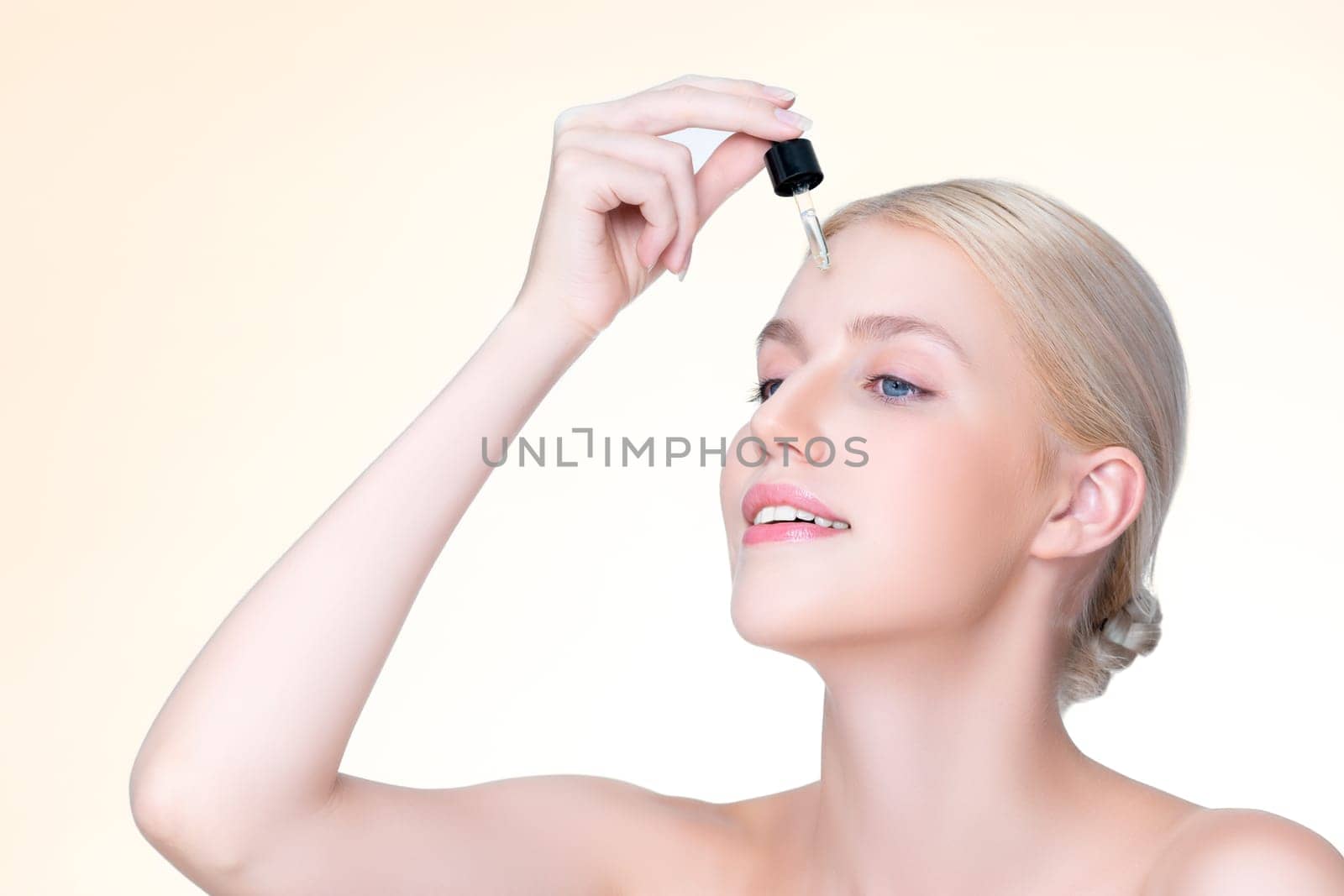 Closeup personable beautiful woman holding CBD oil in isolated background. by biancoblue