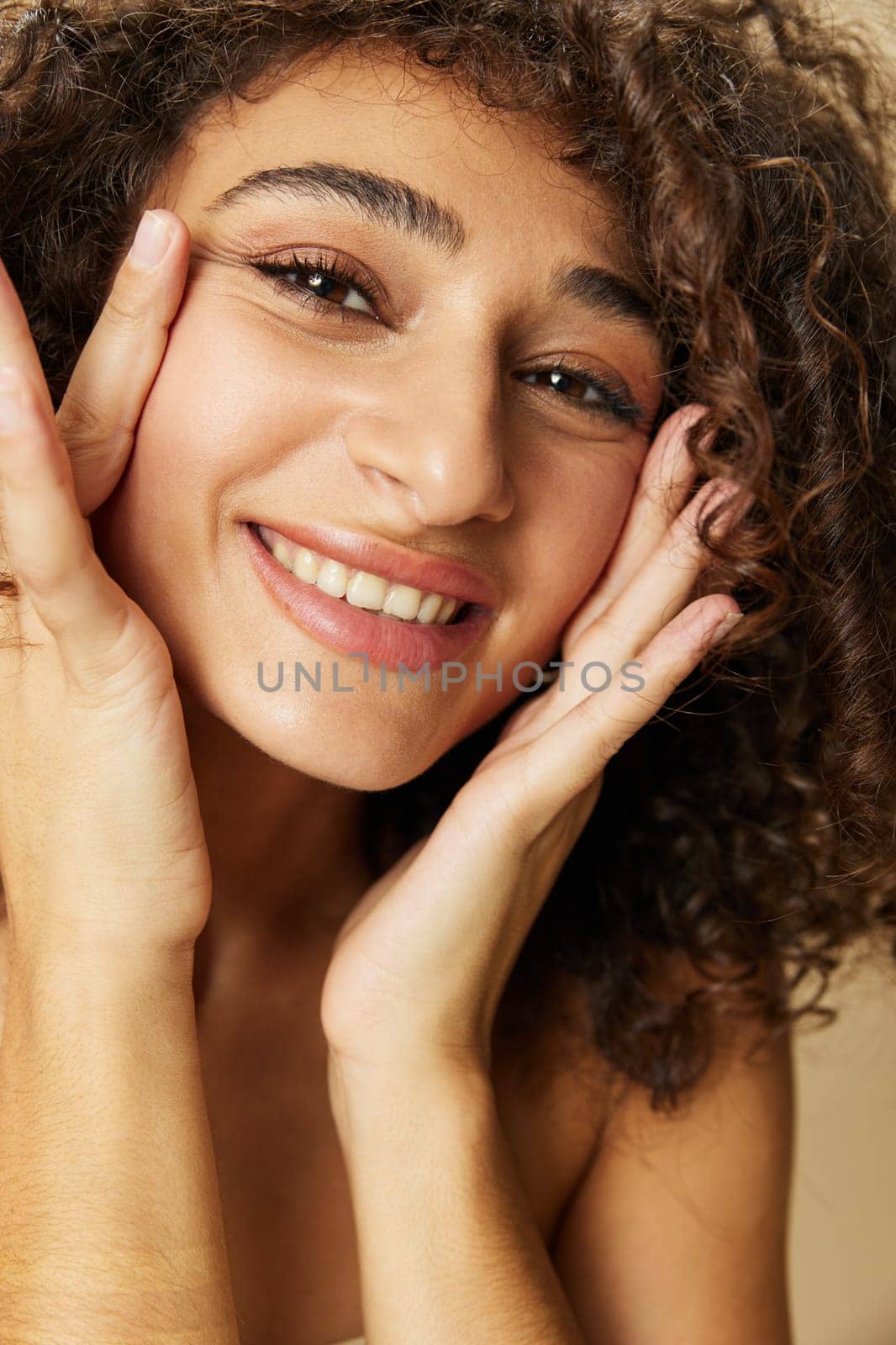 Woman beauty face close-up skin health nails and hair, hair dryer style curly afro hair, body and beauty care concept. High quality photo