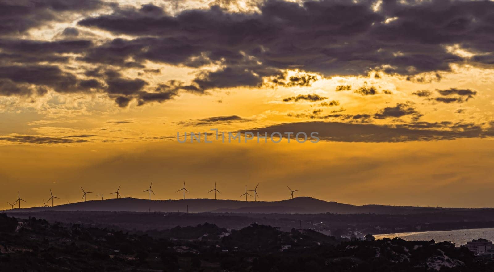Abstract background sky Dawn Sunset Contrast dark shadow bright cloud sun orange silhouette above the mountains near the sea.