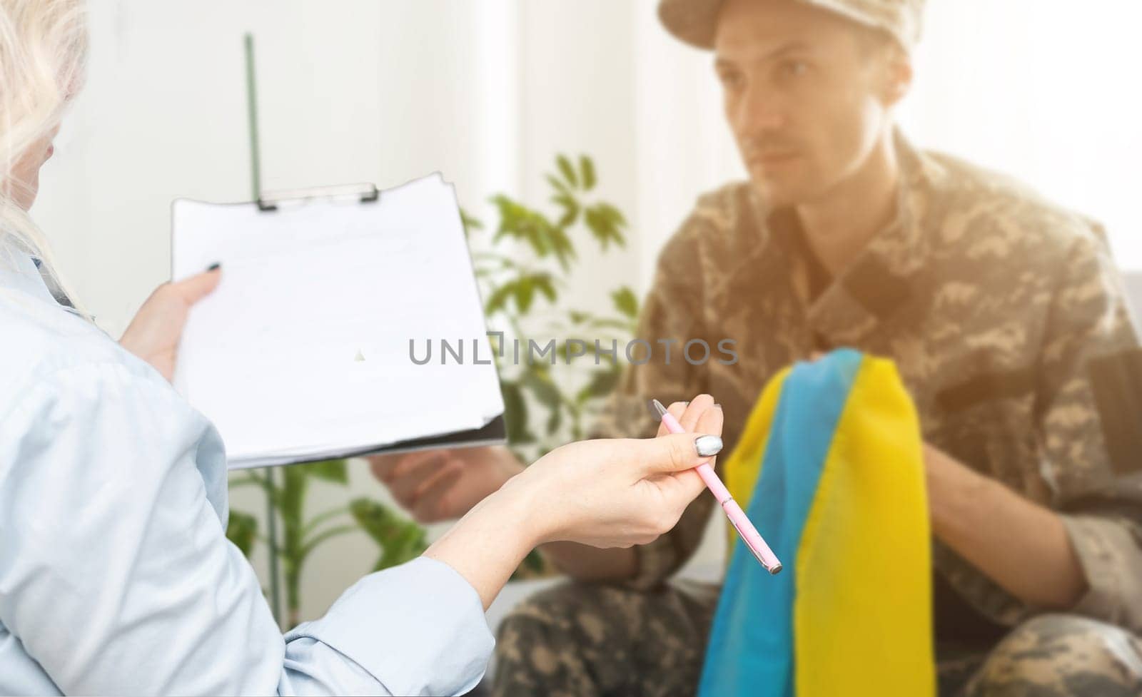 Psychologist working with military officer from Ukraine.