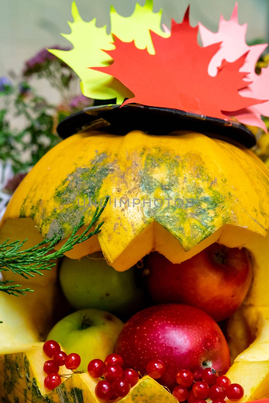Decoration for Halloween. Autumn holiday. Halloween celebration. Pumpkin ate fruits and berries